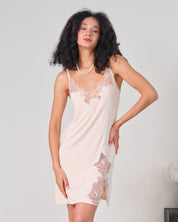 Effetto bamboo chemise spaghetti strap 03162 – women's sleepwear, rosy peach
Woman wearing a beige lace nightgown against a plain background
