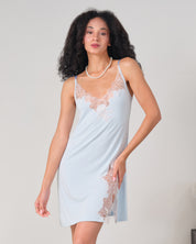 Effetto bamboo chemise spaghetti strap 03162 – women's sleepwear, icy blue
Woman wearing a light blue slip dress with lace details on a plain background