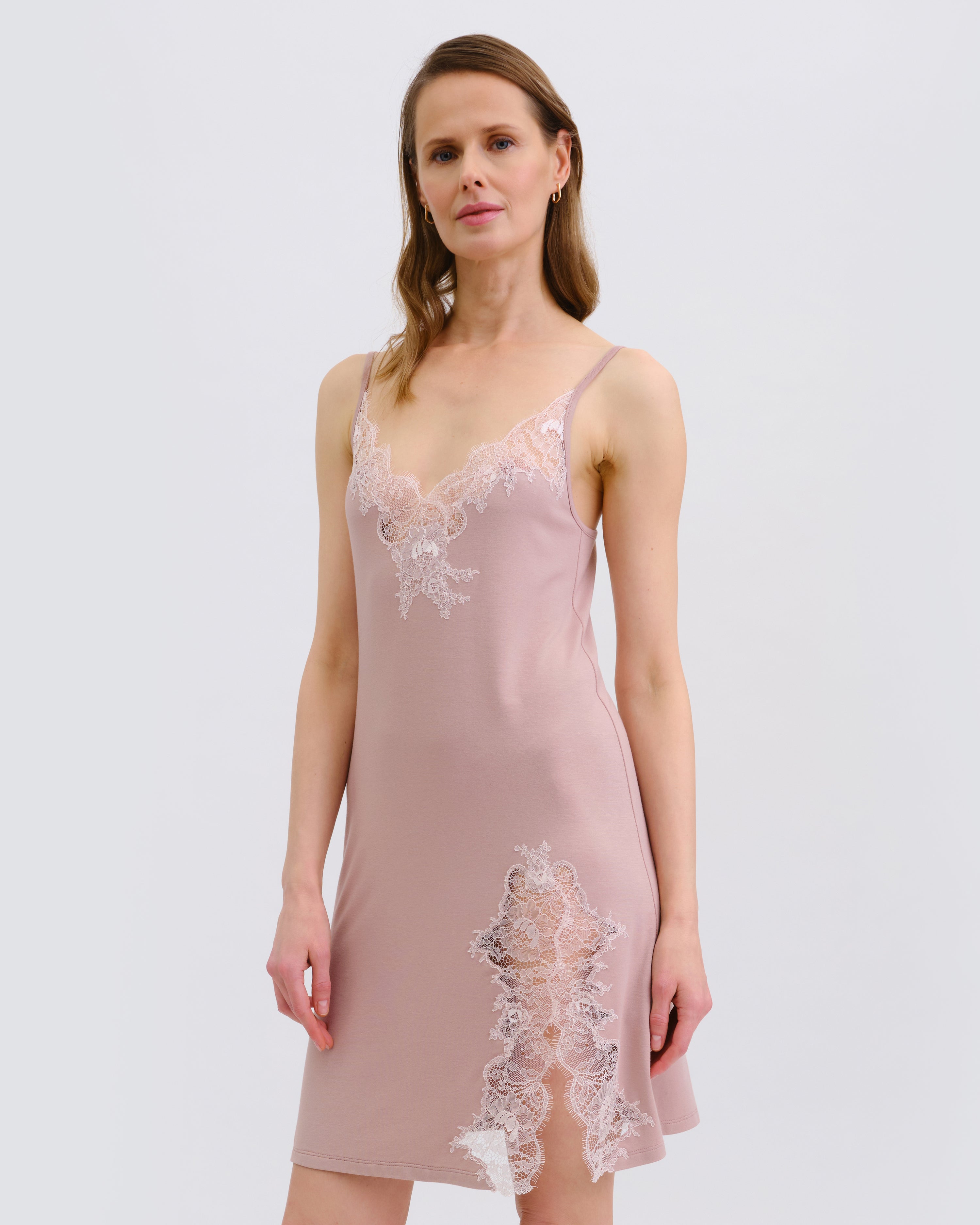 Effetto bamboo chemise spaghetti strap 03162 – women's sleepwear, nude rose
Woman wearing a pink lace nightgown against a white background