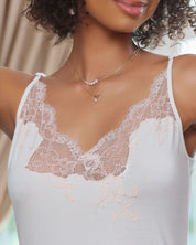 Effetto bamboo chemise spaghetti strap 03162 – women's sleepwear, ivory
White lace camisole worn by a model with a blurred background