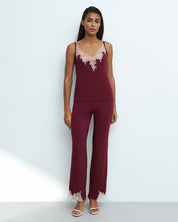 Effetto bamboo camisole pajama set 03163 – women's sleepwear, cherry lacquer
Woman wearing a burgundy camisole pajama set with lace details on a white background