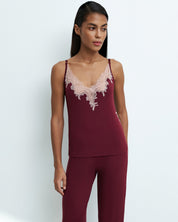 Effetto bamboo camisole pajama set 03163 – women's sleepwear, cherry lacquer
Woman wearing a burgundy lace-trimmed top and pants on a white background