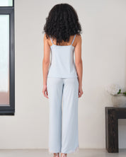 Effetto bamboo camisole pajama set 03163 – women's sleepwear, icy blue
Woman wearing a light blue sleeveless top and wide-leg pants in a minimal indoor setting.