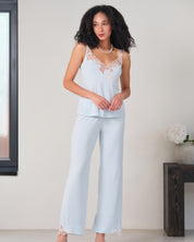 Effetto bamboo camisole pajama set 03163 – women's sleepwear, icy blue
Woman wearing light blue pajama set in a minimalistic room.