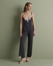 Effetto bamboo camisole pajama set 03163 – women's sleepwear, smoke grey
Woman wearing a dark purple pajama set with lace details on a green background