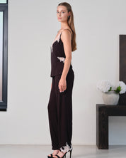 Effetto bamboo camisole pajama set 03163 – women's sleepwear, black
Woman wearing a black outfit with floral details in a minimal indoor setting