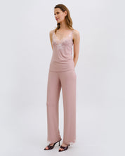 Effetto bamboo camisole pajama set 03163 – women's sleepwear, nude rose
Woman wearing a pink jumpsuit with lace top on a white background