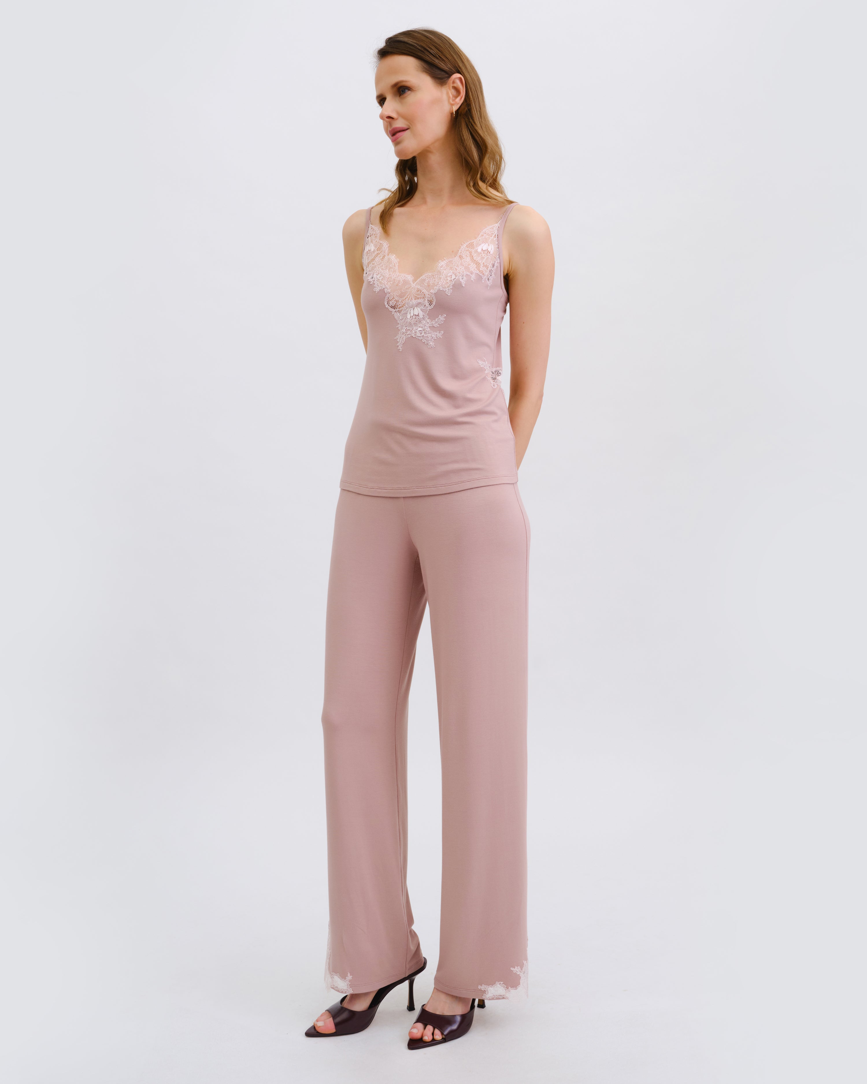Effetto bamboo camisole pajama set 03163 – women's sleepwear, nude rose
Woman wearing a pink jumpsuit with lace top on a white background