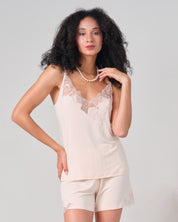 Effetto bamboo cami shorts set 03163 – women's sleepwear, rosy peach
Woman wearing a beige lace camisole and shorts set on a light gray background