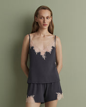 Effetto bamboo cami shorts set 03163 – women's sleepwear, smoke grey
Woman wearing a navy blue lace lingerie set against a green background