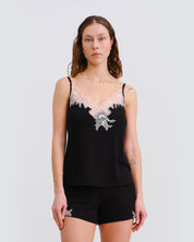 Effetto bamboo cami shorts set 03163 – women's sleepwear, black
Woman wearing a black lace-trimmed top and shorts on a white background