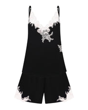 Effetto bamboo cami shorts set 03163 – women's sleepwear, black
Black slip dress with white floral embroidery on a white background