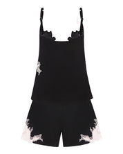 Effetto bamboo cami shorts set 03163 – women's sleepwear, black
Black romper with white floral patterns on a white background